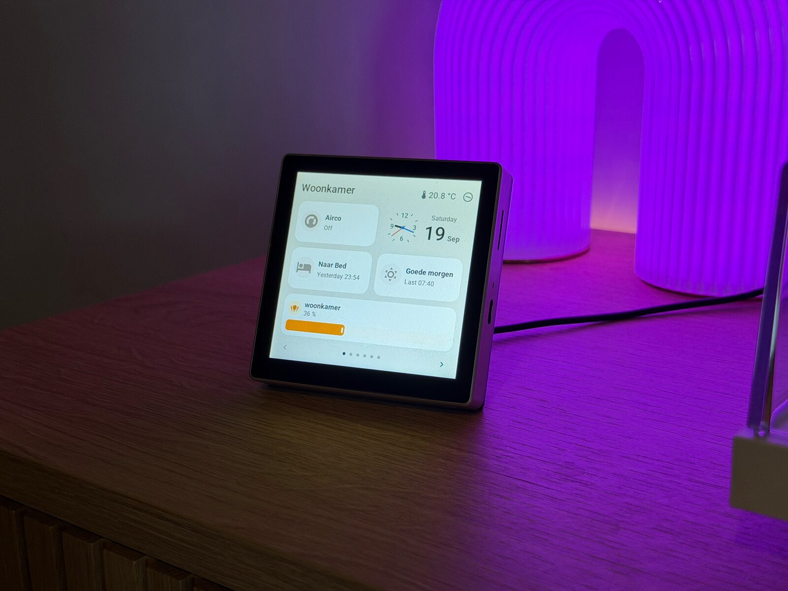 A 4-inch Guition on a sideboard, showing room controls beside the lamp it controls